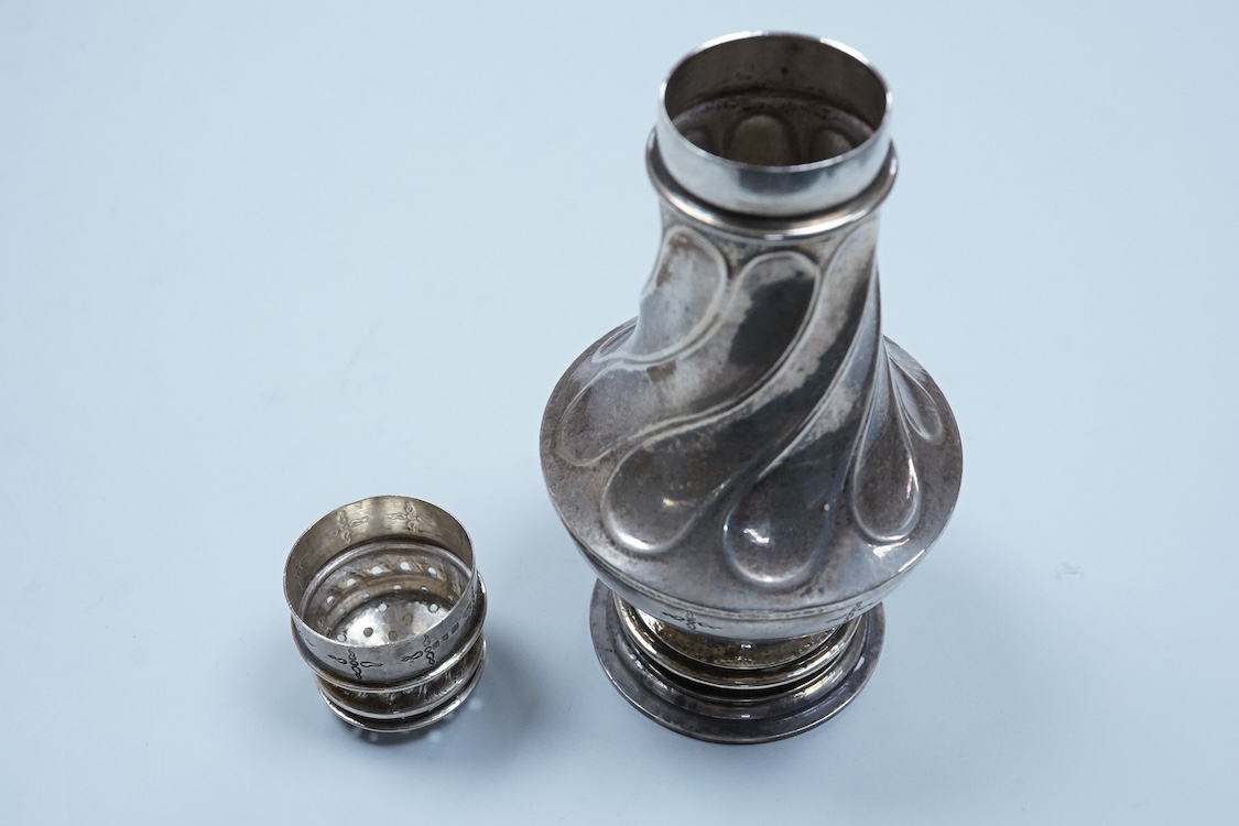 A George V Arts & Crafts silver sugar caster, by Omar Ramsden, with spiral decoration and engraved with stylised stars, London, 1931, 14.9cm, 5.3oz.